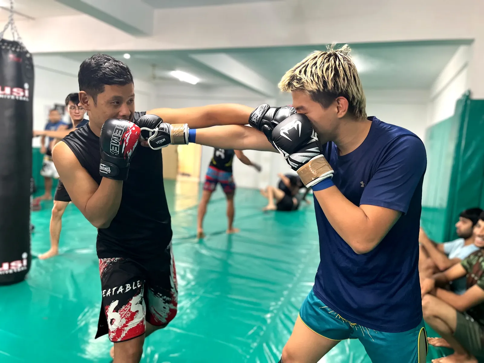 Kaizen MMA athletes practising boxing on the mats