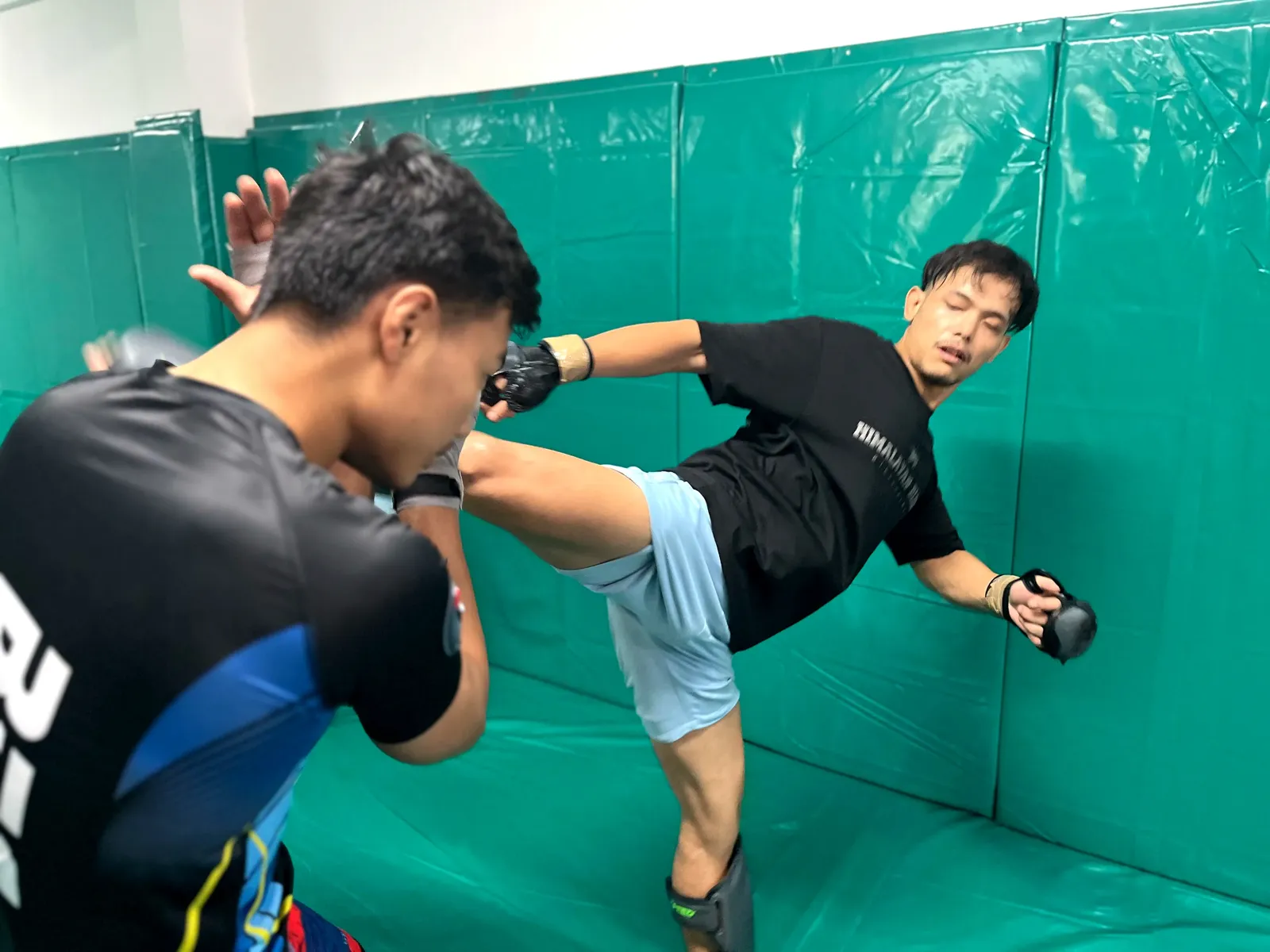 Muay Thai pad work at Kaizen MMA
